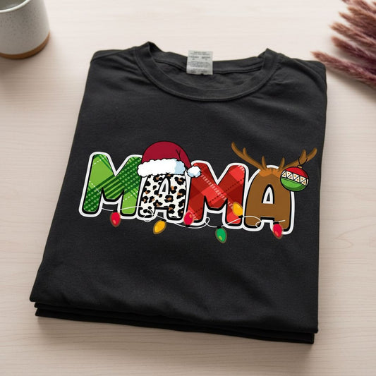 A black t-shirt with a colorful graphic design featuring the word "MAMA" in a playful font, along with a Santa hat and Christmas lights.