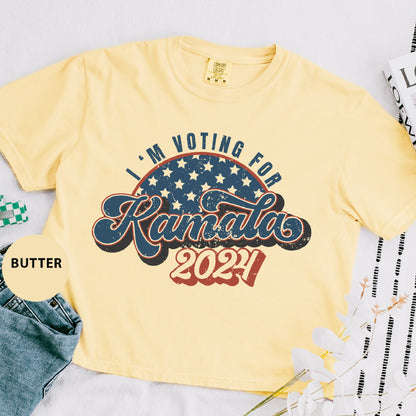 a t - shirt that says i'm voting for kansas, and a pair