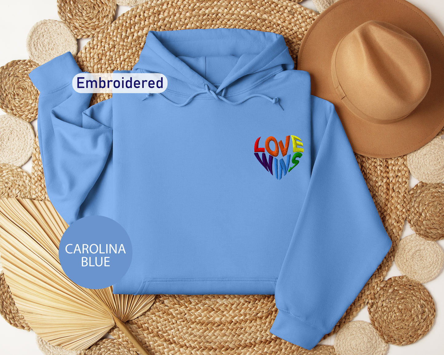 a blue hoodie with the word love embroidered on it