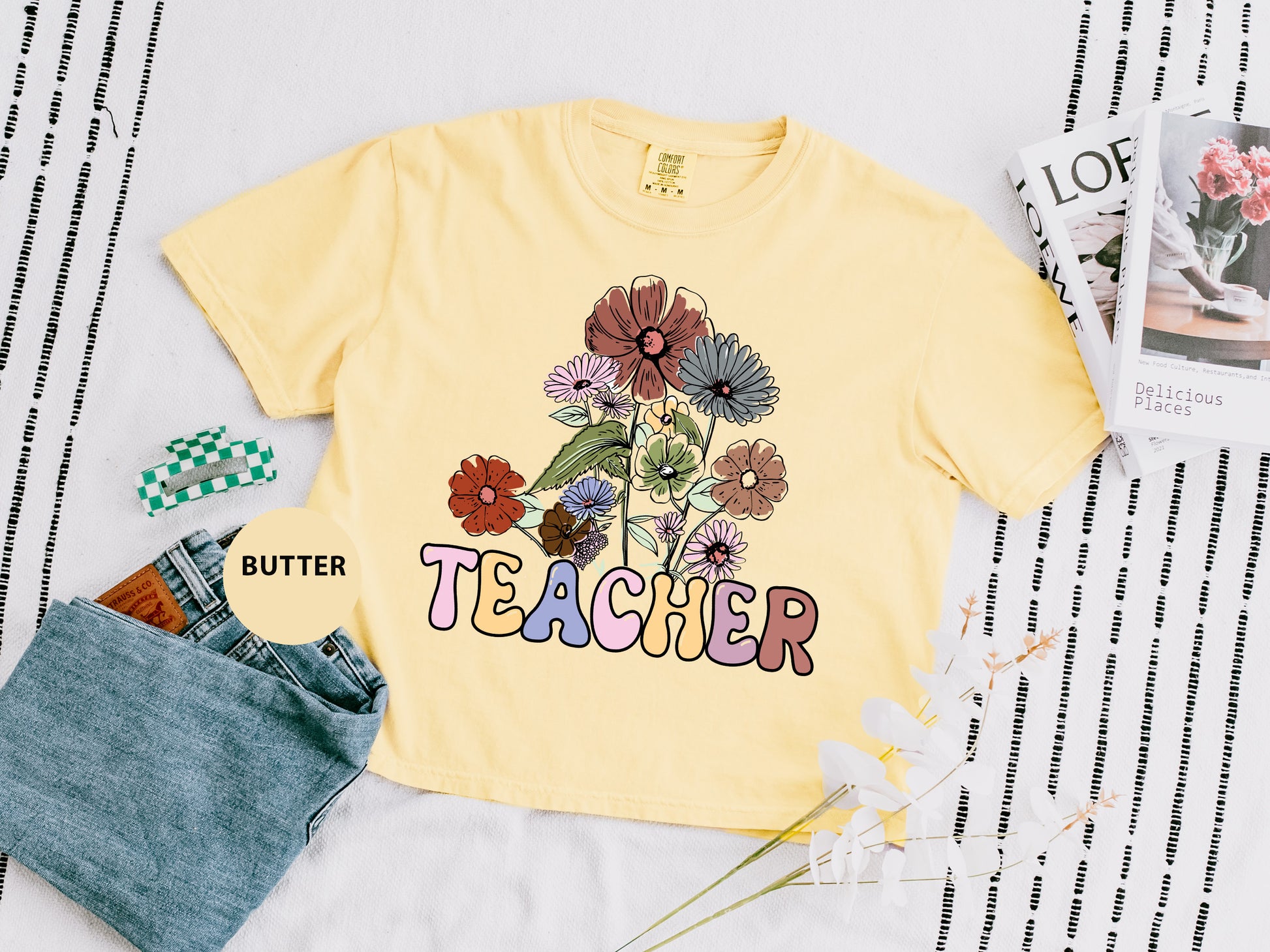 a t - shirt that says teacher with flowers on it