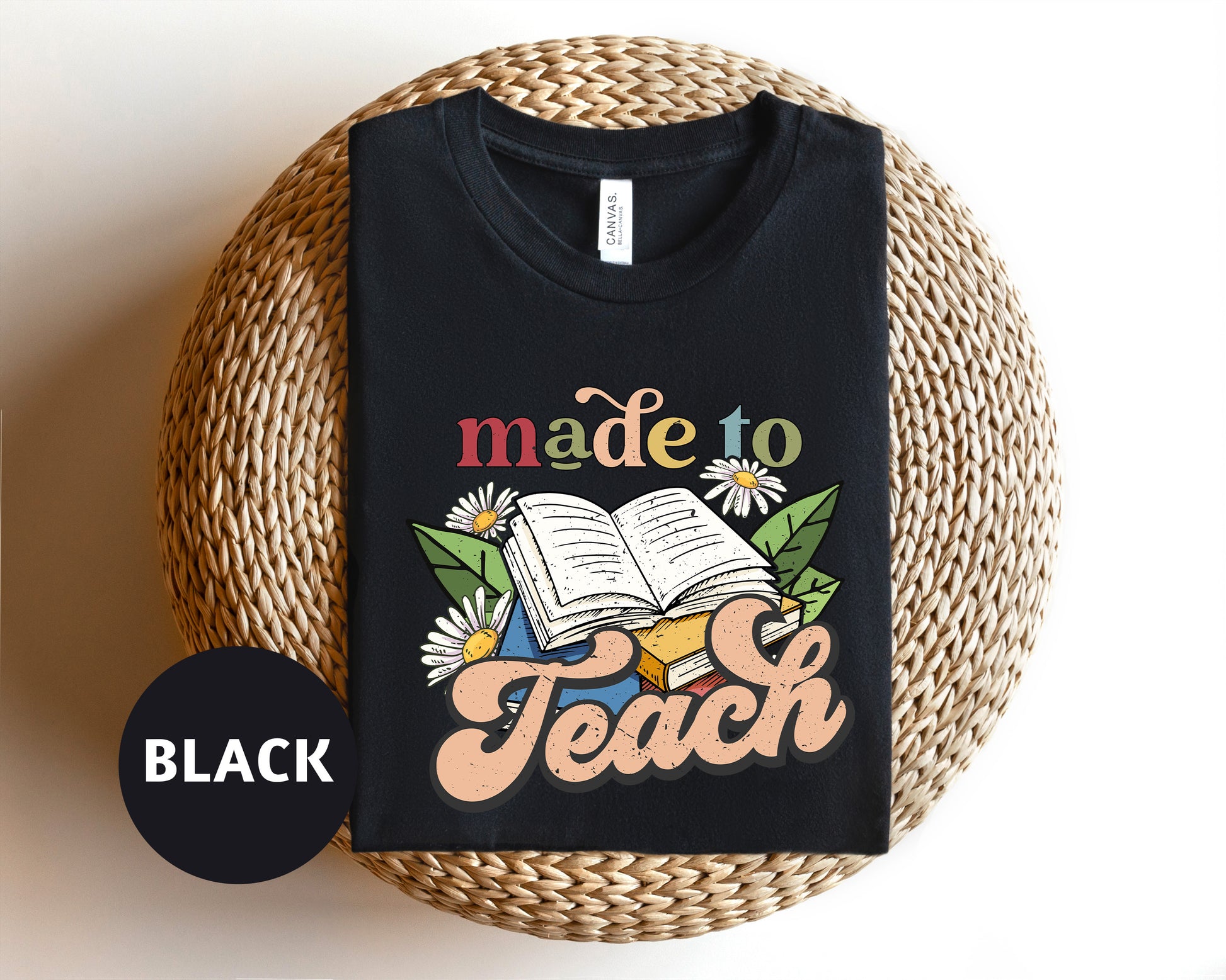 a black t - shirt with the words made to teach printed on it