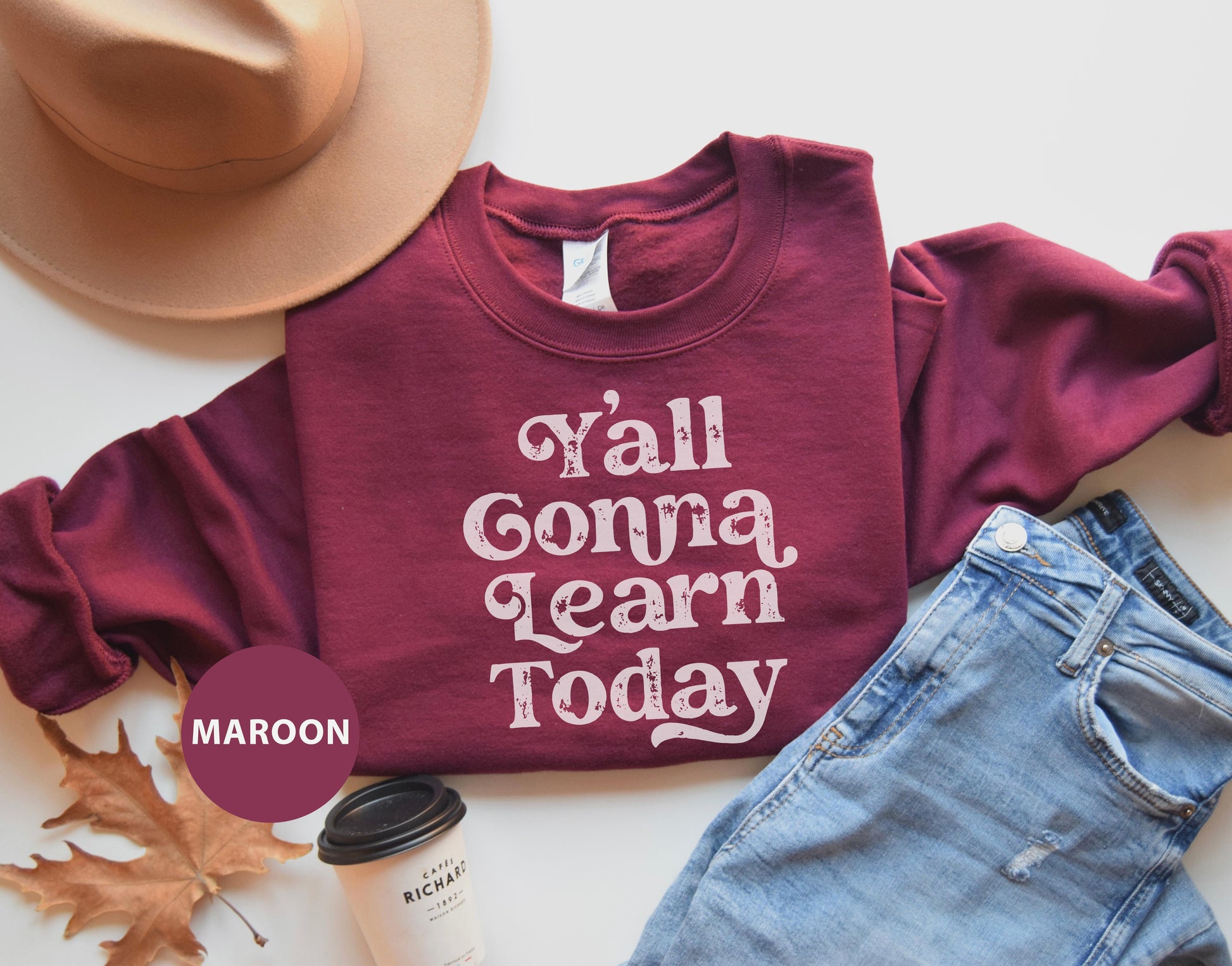 a maroon shirt that says y'all gona learn today