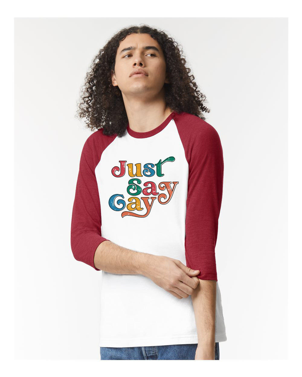 a man wearing a red and white shirt with the words just gay on it