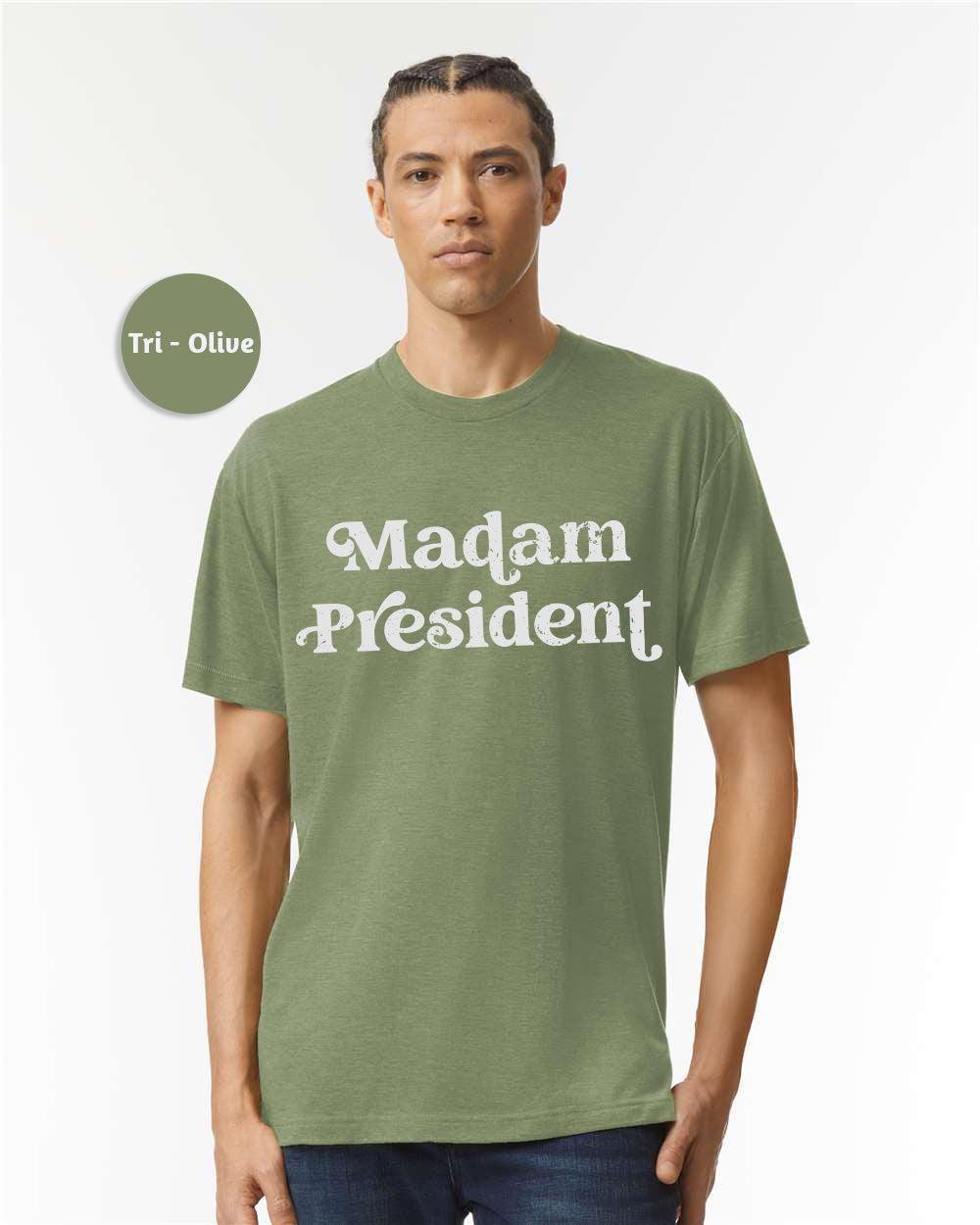 a man wearing a green shirt with the words madam president on it