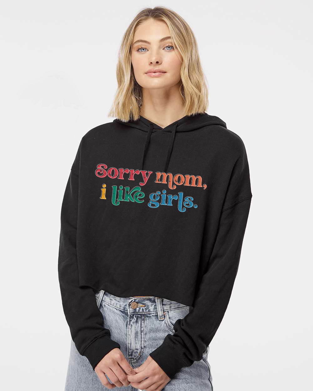 a woman wearing a black hoodie that says sorry mom, i like girls