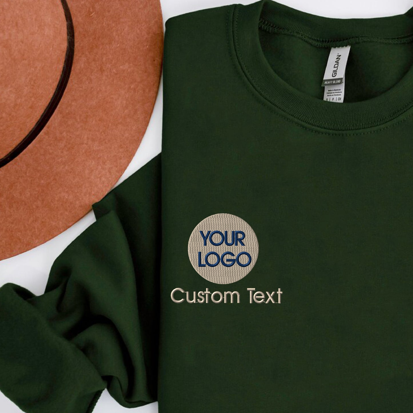 a green t - shirt with a brown hat next to it