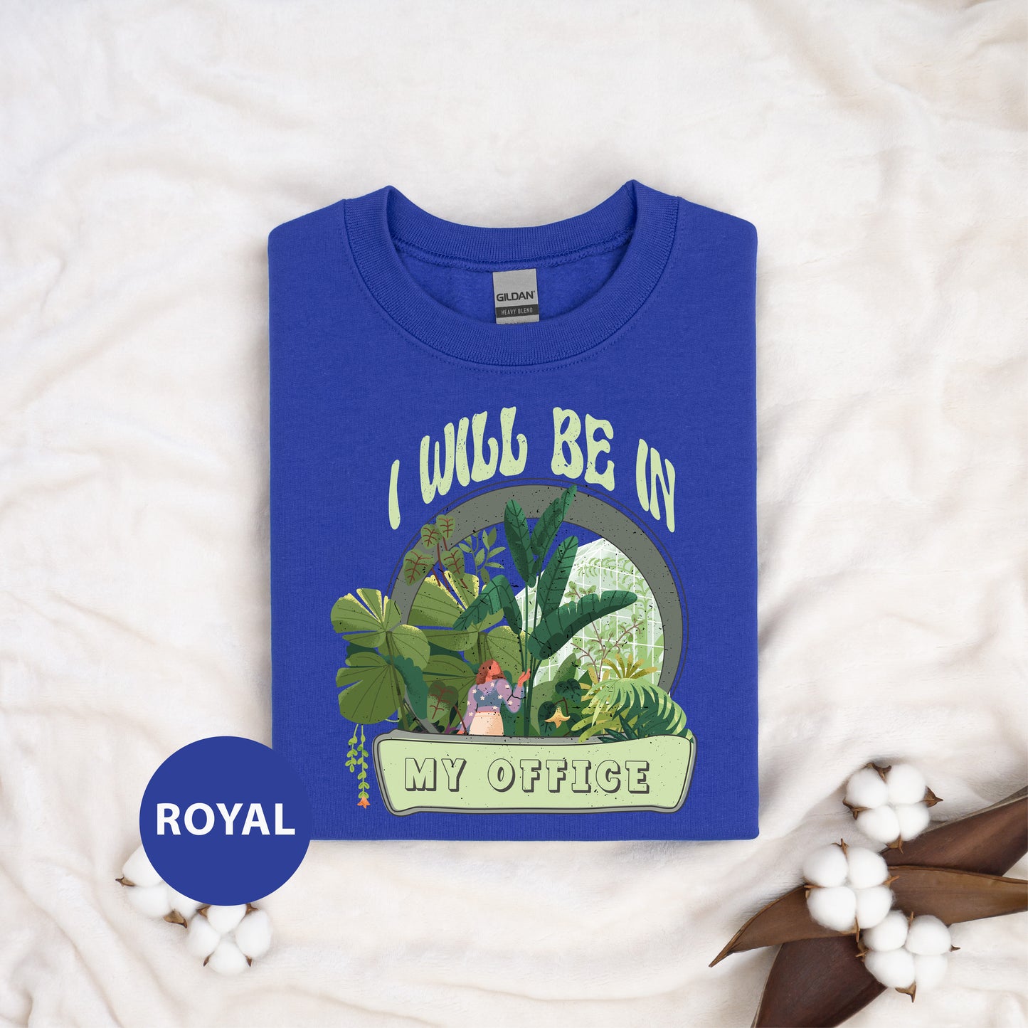 a blue t - shirt with a picture of a house plant on it