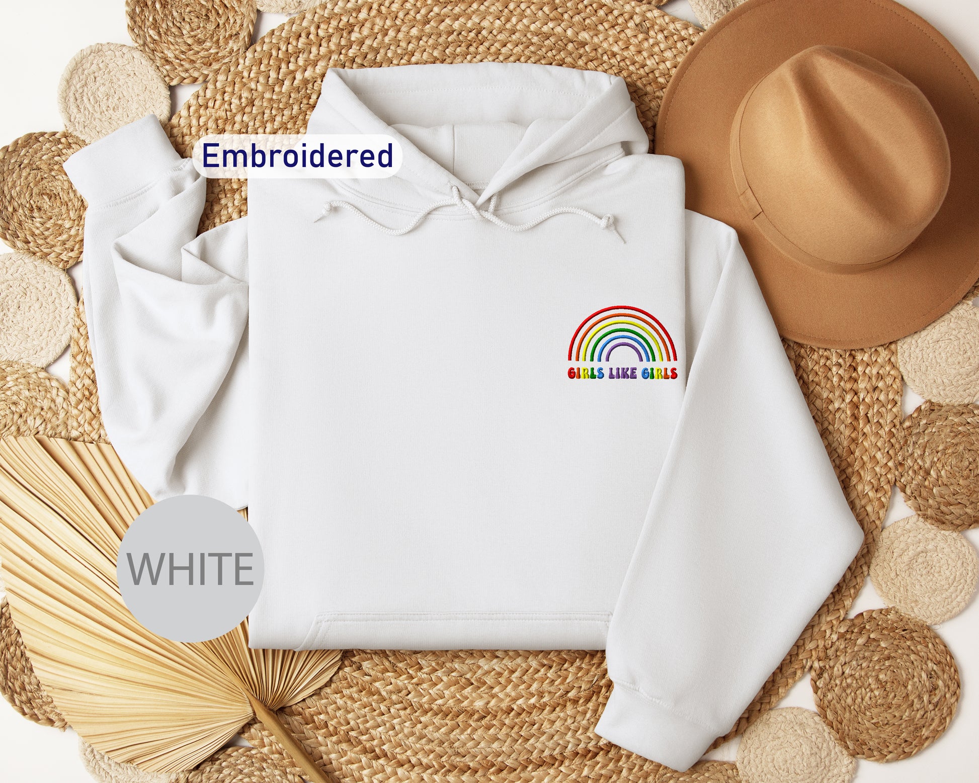 a white hoodie with a rainbow embroidered on it