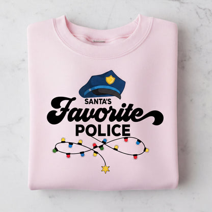 A pink sweatshirt with a graphic design featuring a police officer's hat and the text "Santa's Favorite Police" along with colorful lights.