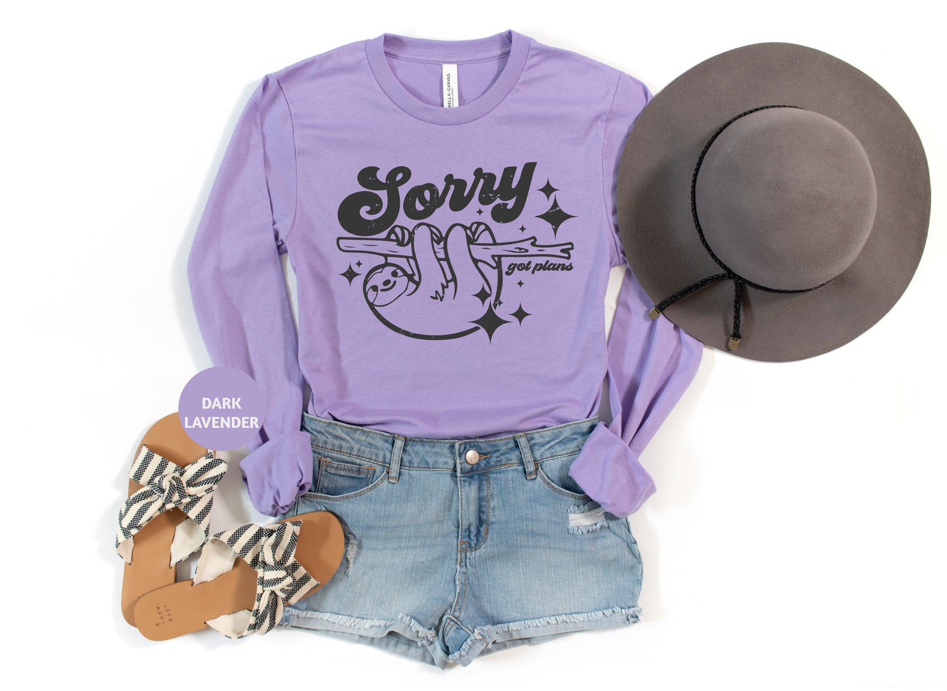 a purple shirt with a cowboy hat and a pair of shorts