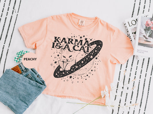 a t - shirt that says karma is a cat on it