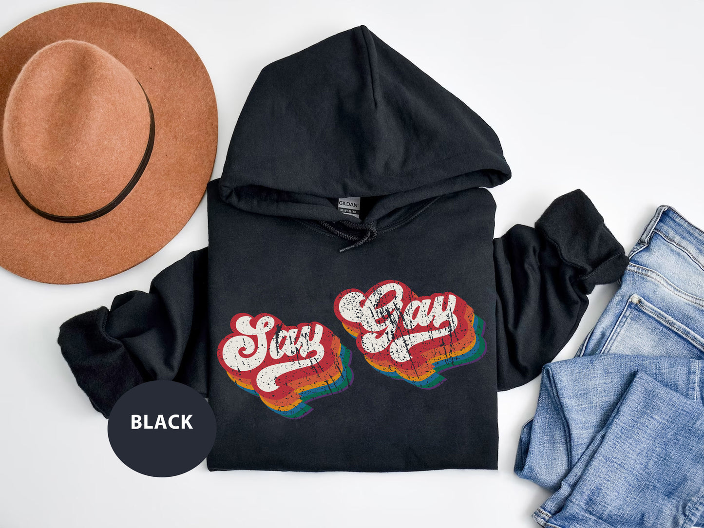 a black hoodie with a pair of shoes and a hat