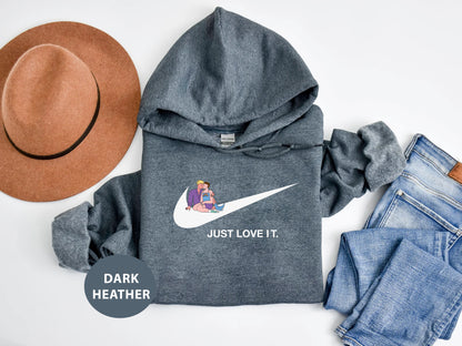 a hoodie, jeans, hat, and a pair of shoes on a white