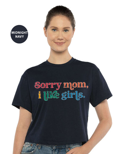 a woman wearing a t - shirt that says sorry mom, i like girls