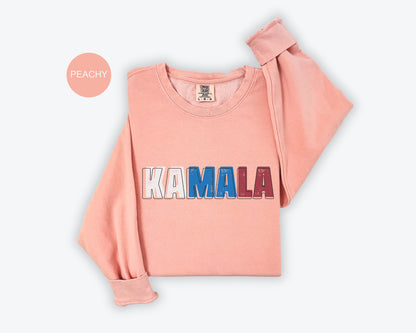 a pink sweatshirt with the word kaamala printed on it