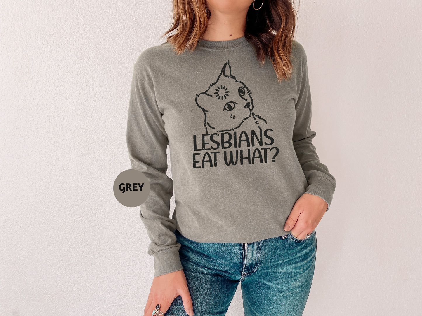 a woman wearing a sweatshirt with a cat on it