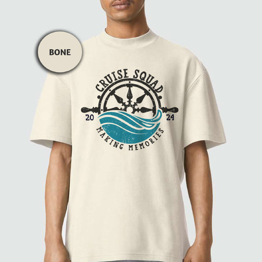 a man wearing a white tshirt with a graphic of a ship wheel and