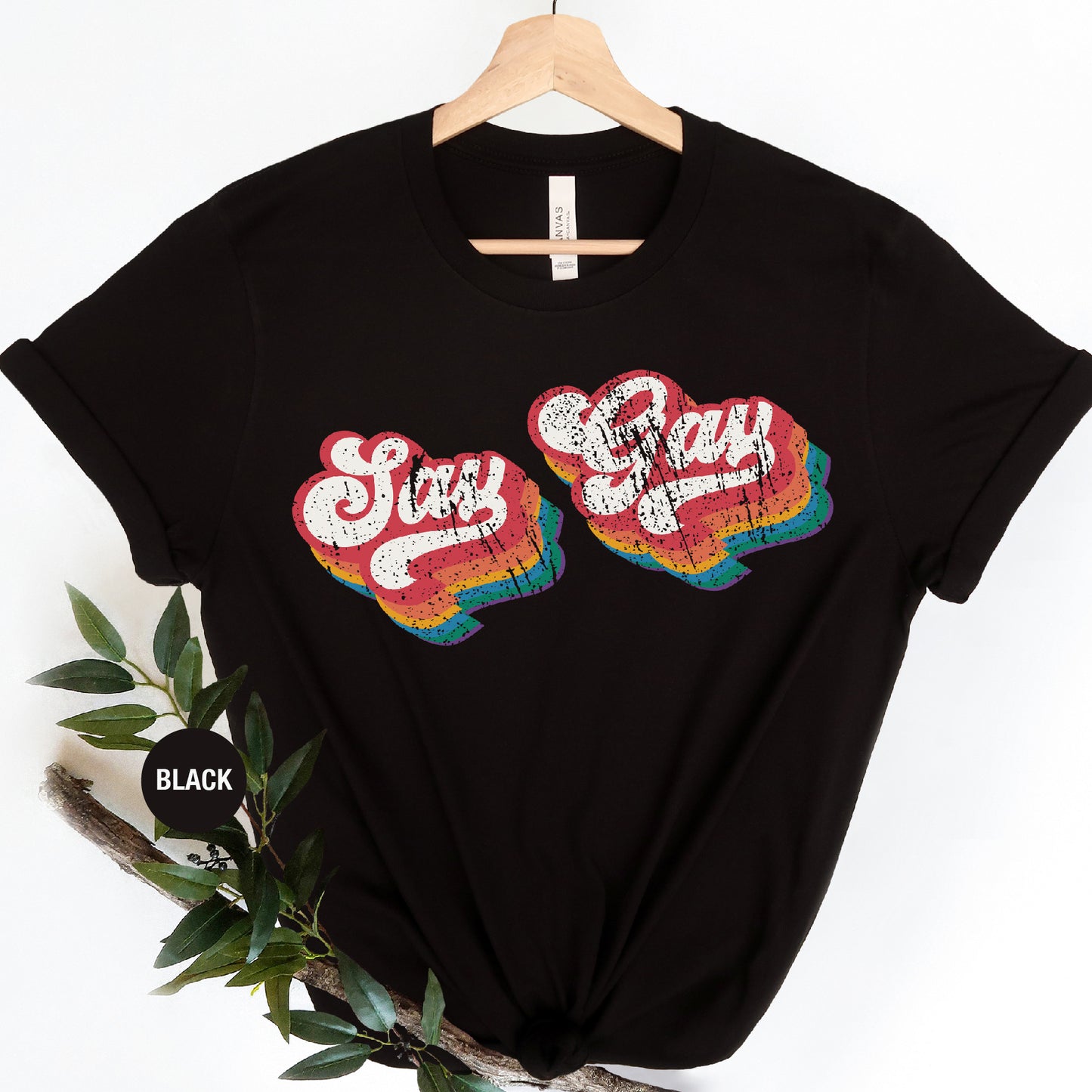 a black t - shirt with two hearts that say stay cozy