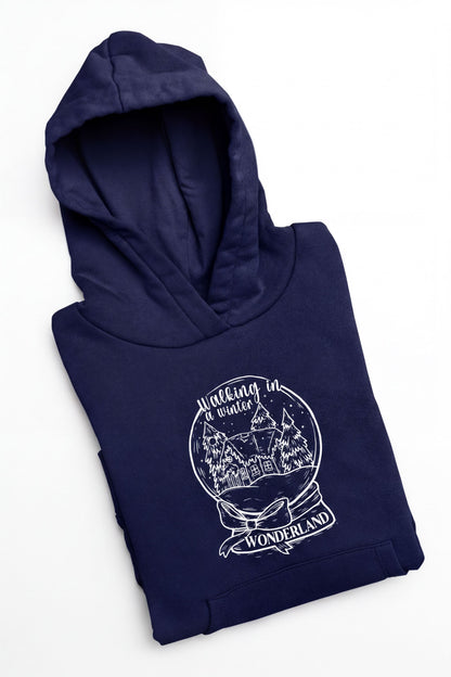 A navy blue hoodie with a white graphic design depicting a snow globe and the text "Walking in a winter wonderland".