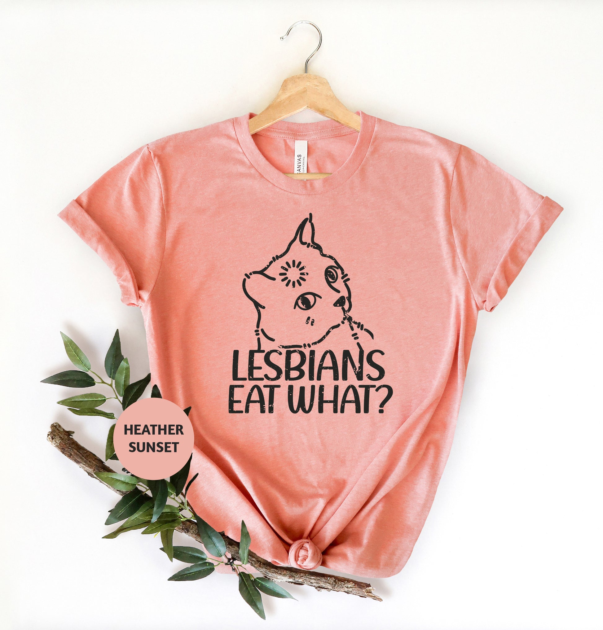 a t - shirt that says lesbians eat what? with a picture of a