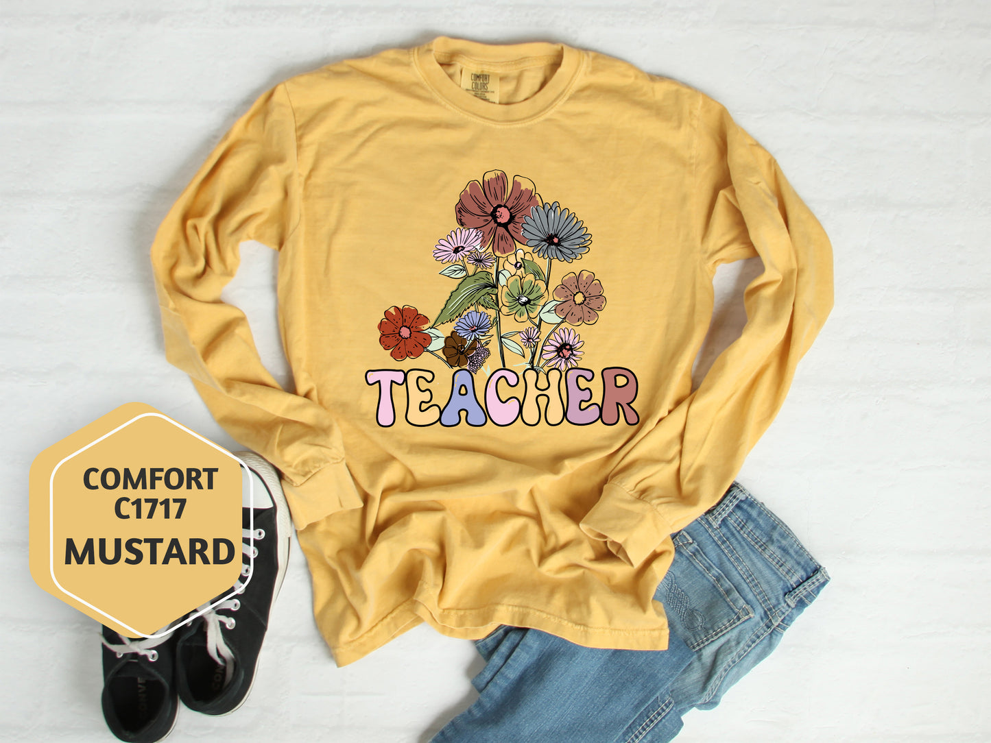 a t - shirt that says teacher with flowers on it