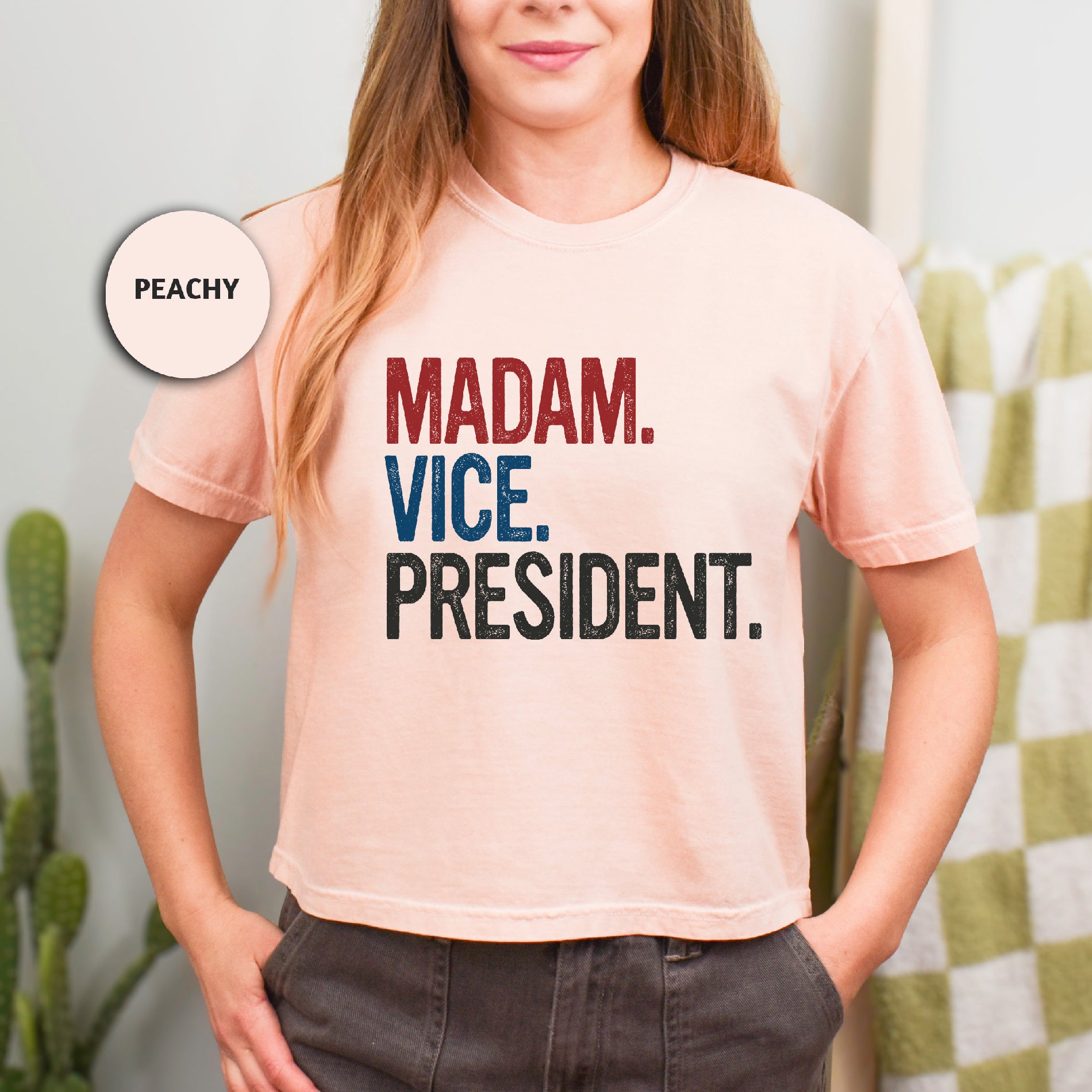 a woman wearing a t - shirt that says madam vice president