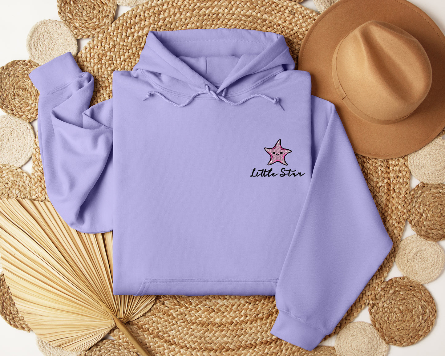 a purple hoodie with a pink star on it