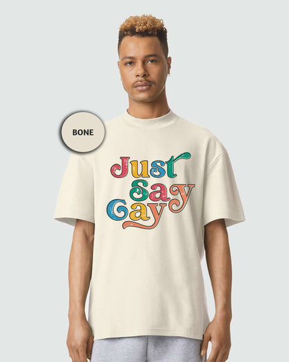 a man wearing a white t - shirt with the words just gay printed on it