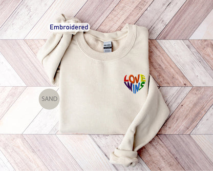 a white sweater with the words love me embroidered on it