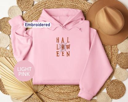 a pink hoodie with the words hall low een on it