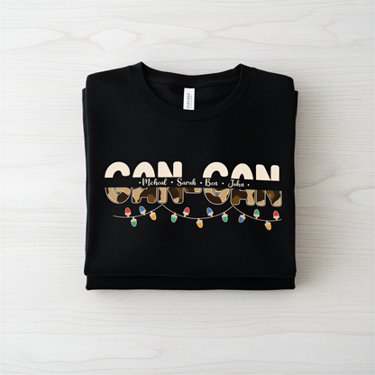 A black t-shirt with the text "CAN CAN" printed on it, along with the names "Michael", "Sara", and "Ben" written below it.