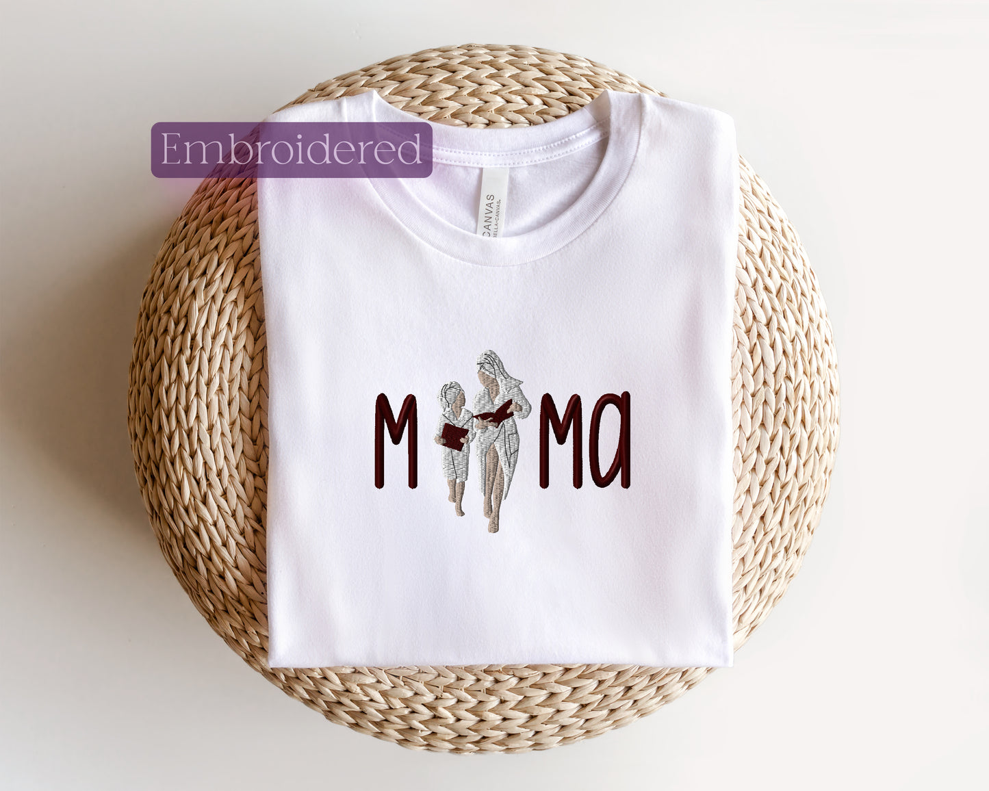 a white t - shirt with the word mom printed on it