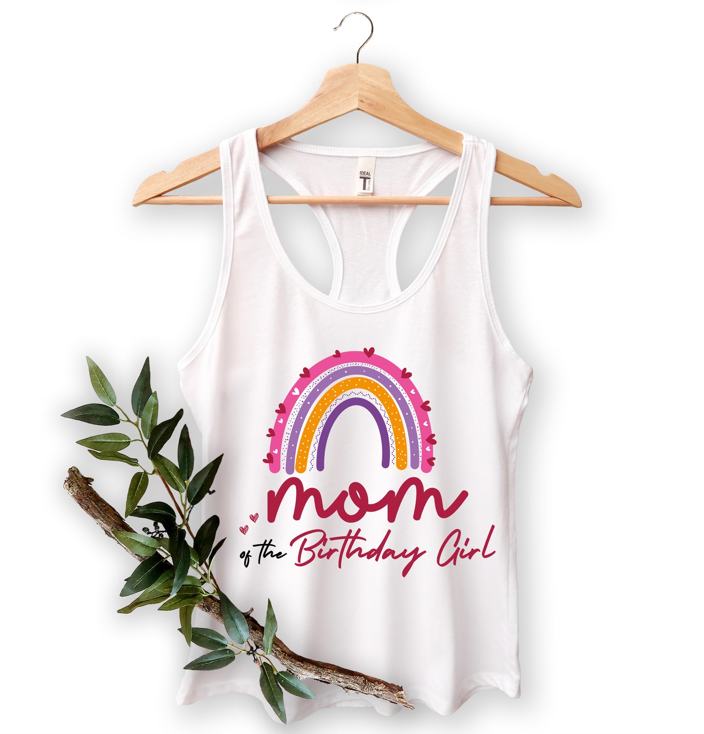 A white tank top with a colorful graphic design and text, hanging on a wooden hanger.