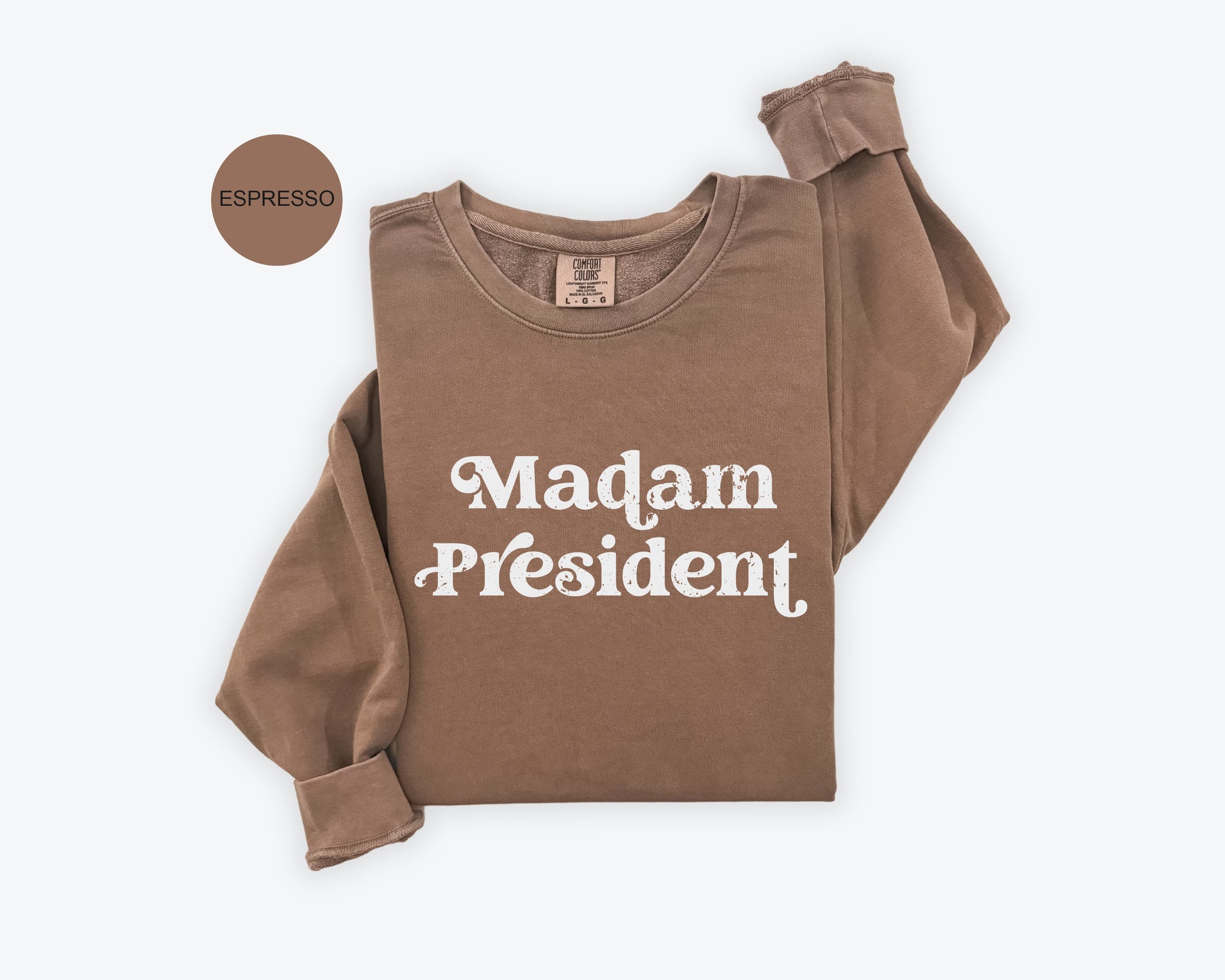 a brown shirt with the words madam president printed on it