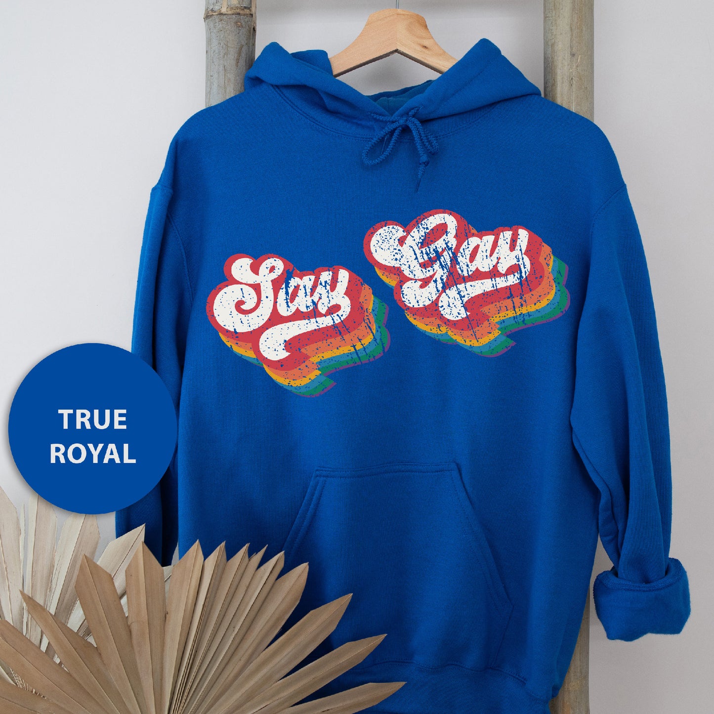 a blue hoodie with the words stay gay on it