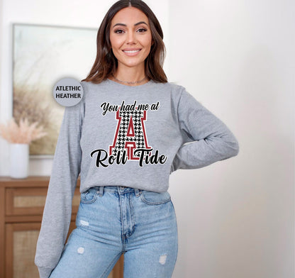 a woman wearing a sweatshirt with the letter a on it