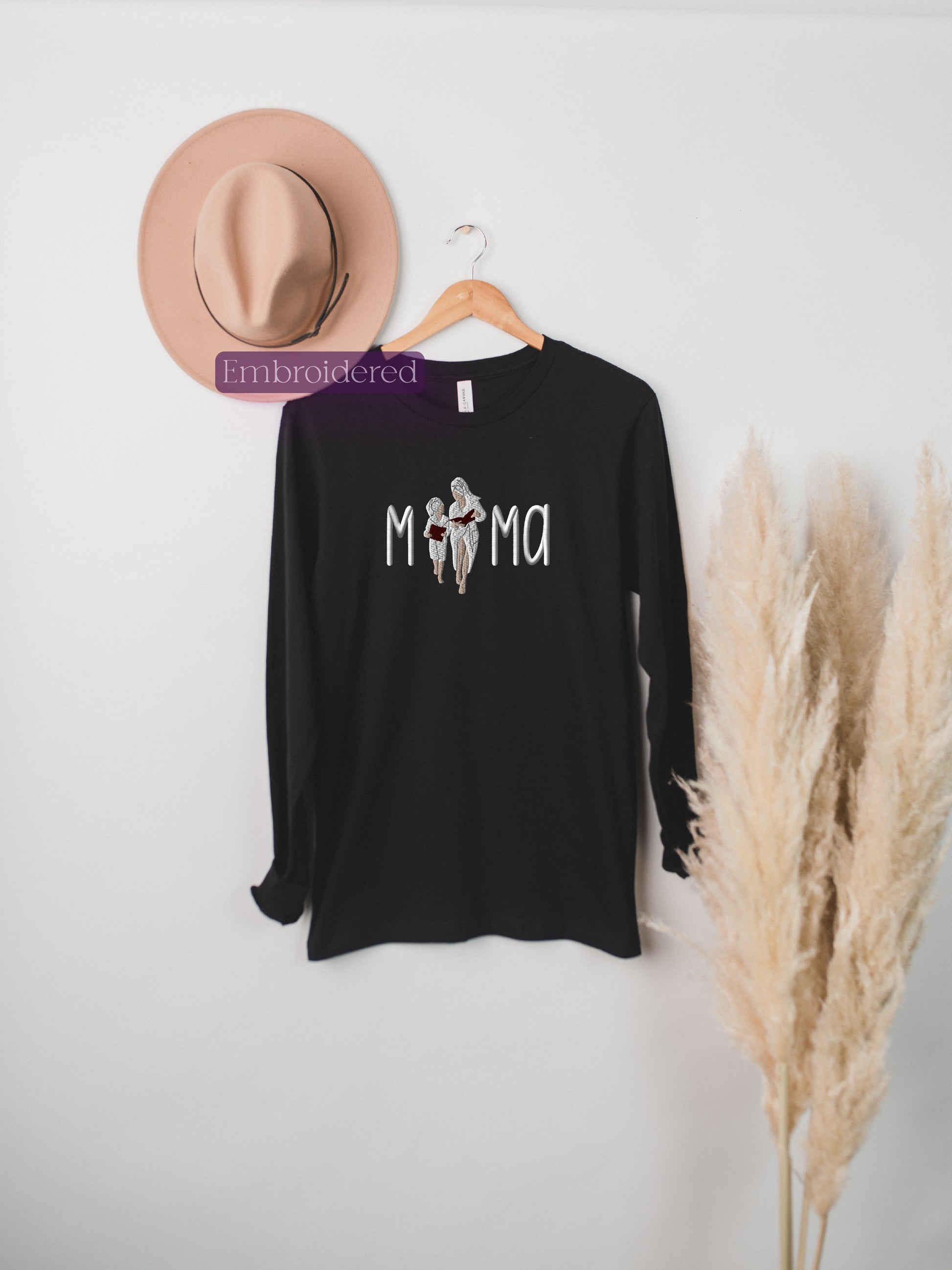 a hat and a t - shirt hanging on a wall