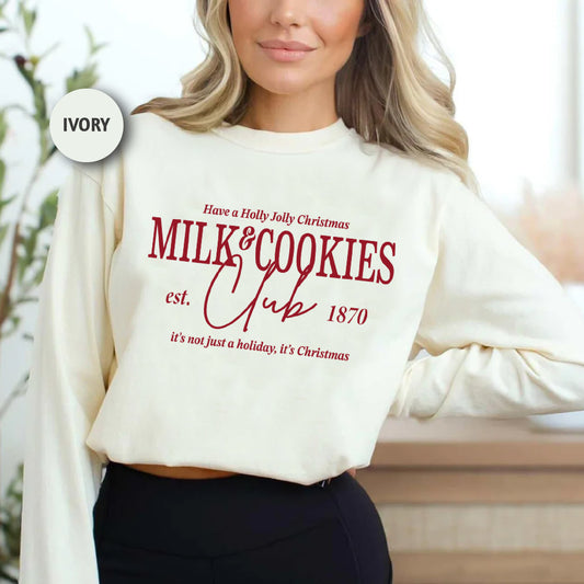 a woman wearing a white sweatshirt and black pants