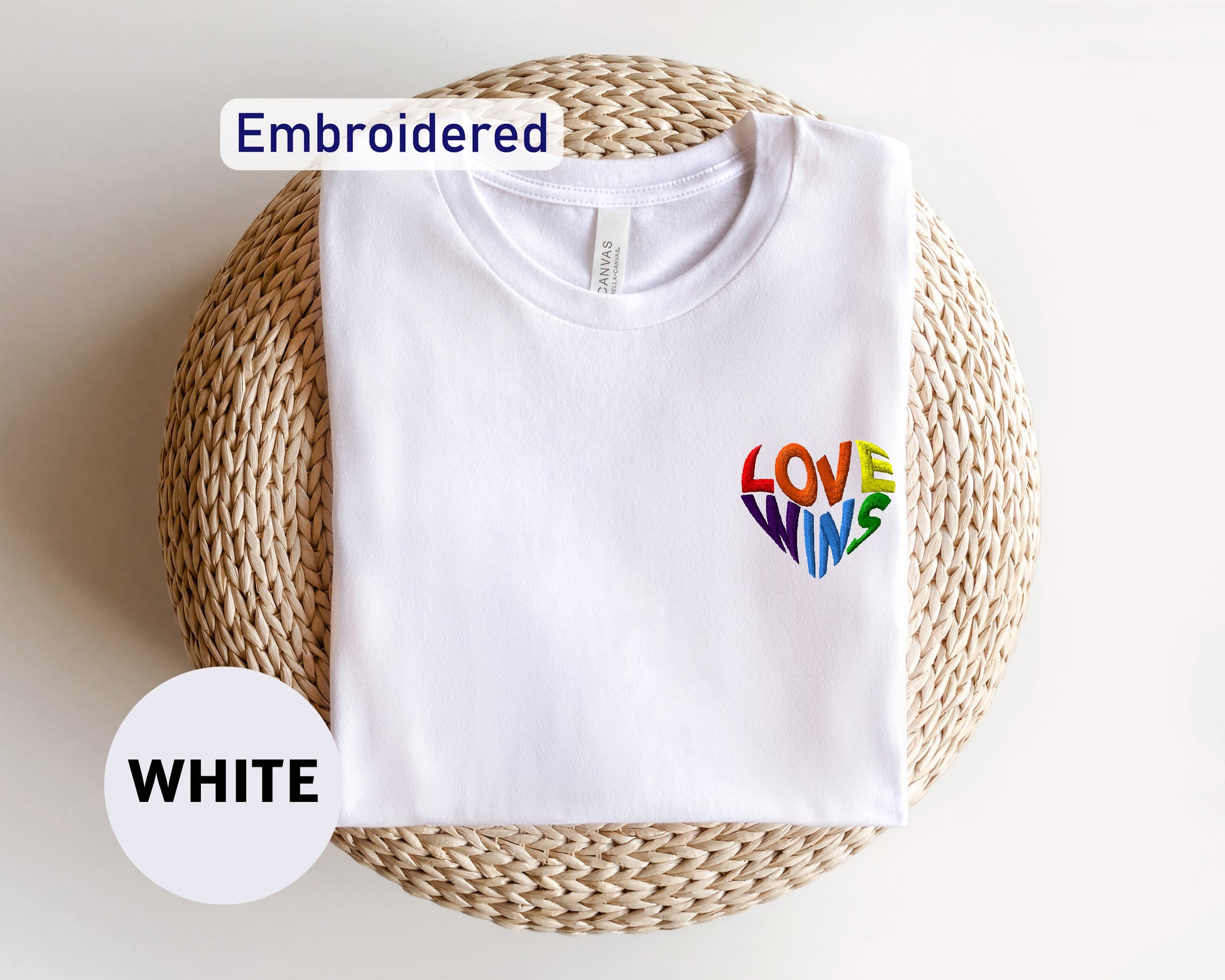 a white t - shirt with the words love is written on it