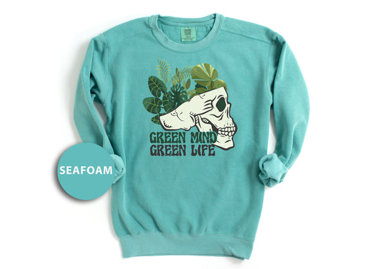 a green sweatshirt with a picture of a dog on it