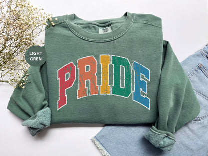 a green sweatshirt with the word pride printed on it