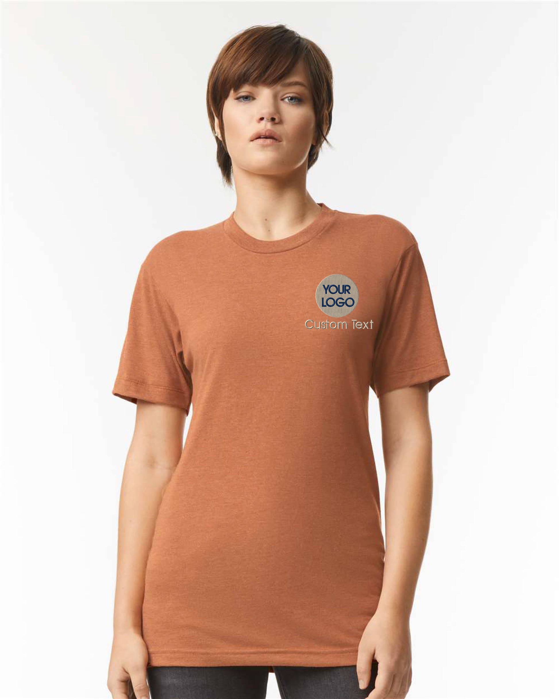 a woman wearing an orange tshirt with a blue logo on it