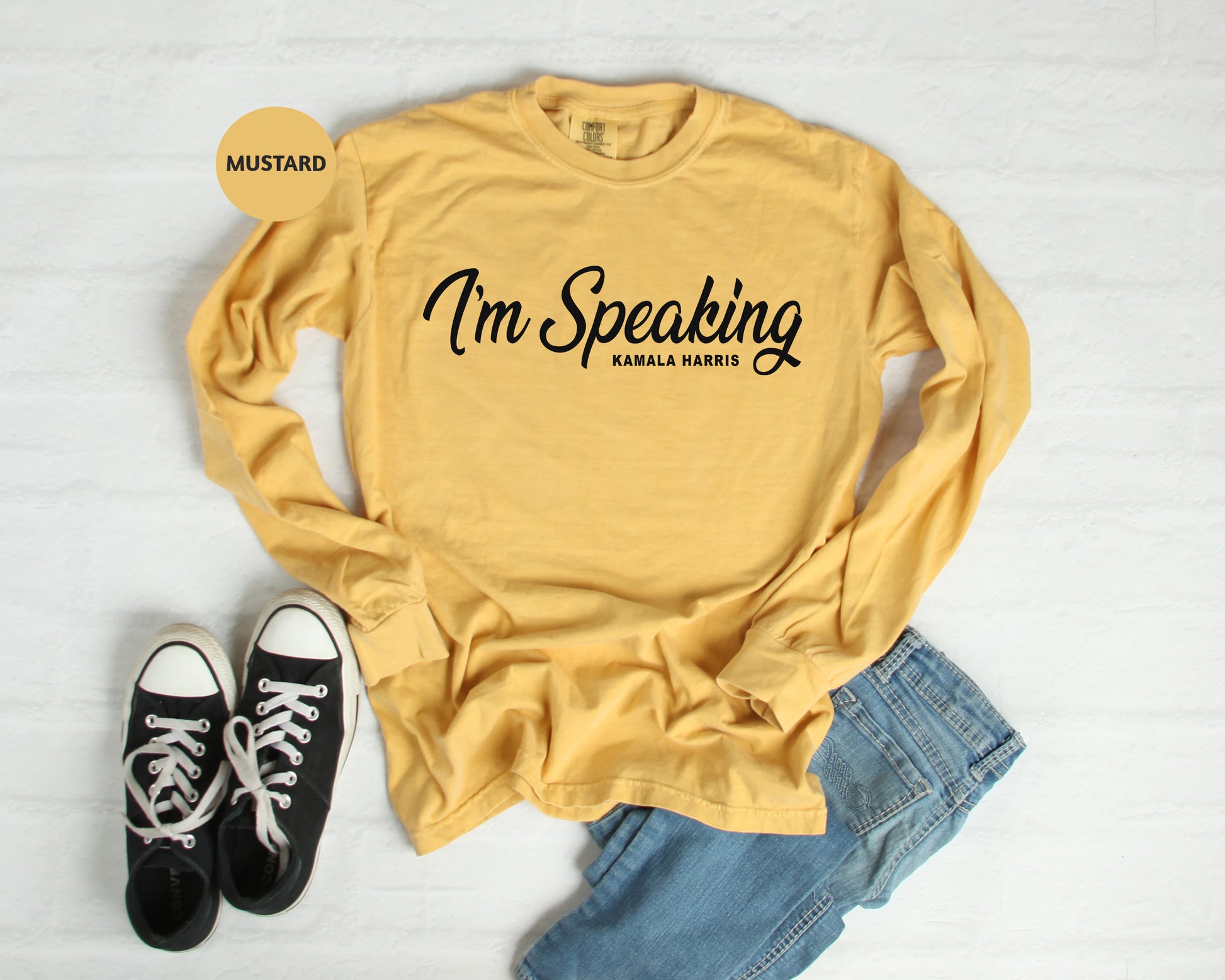 a t - shirt that says i'm speaking with a pair of black sneakers