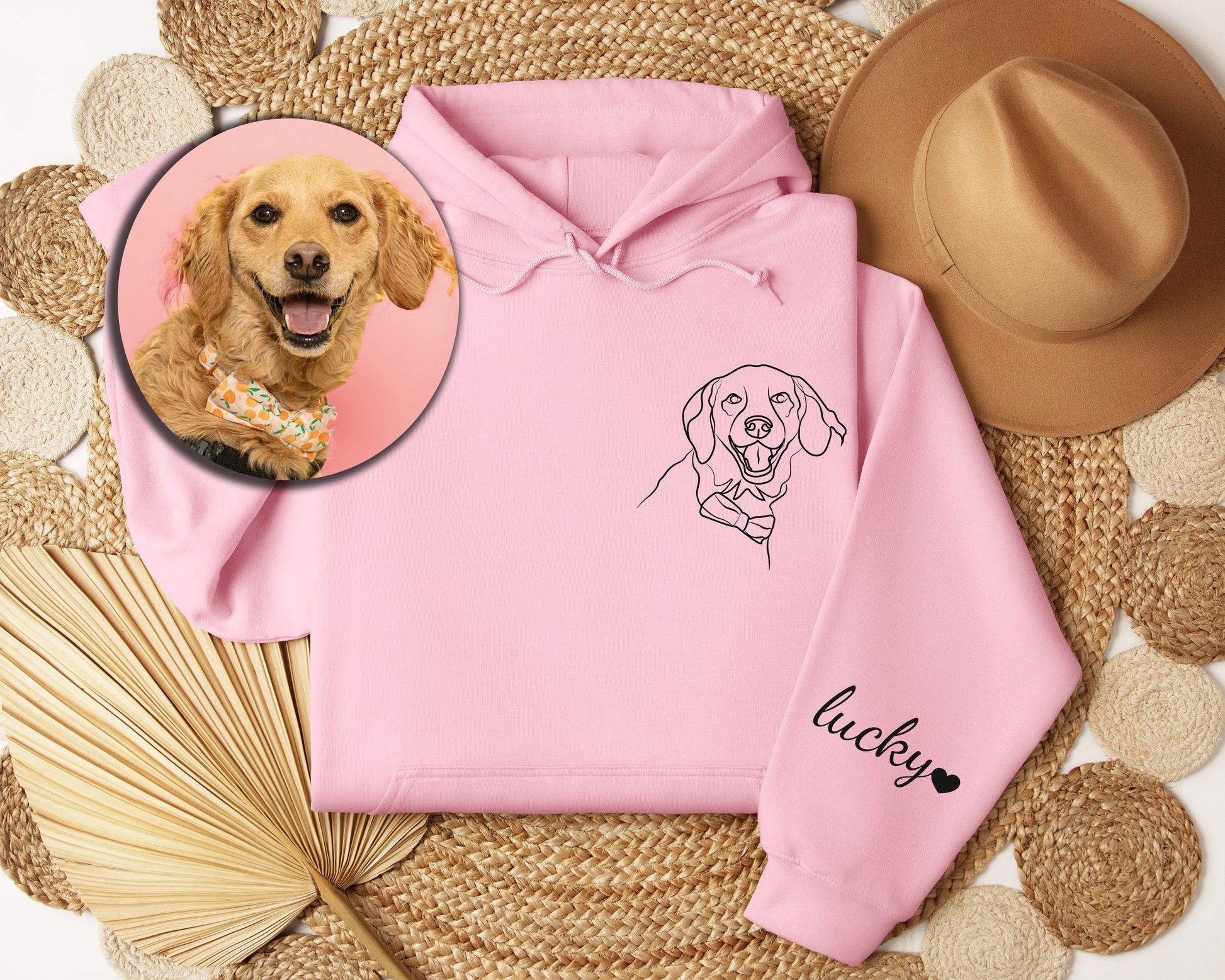 a pink hoodie with a picture of a dog on it