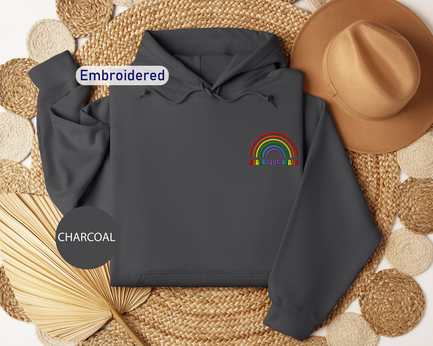 a gray hoodie with a rainbow embroidered on it