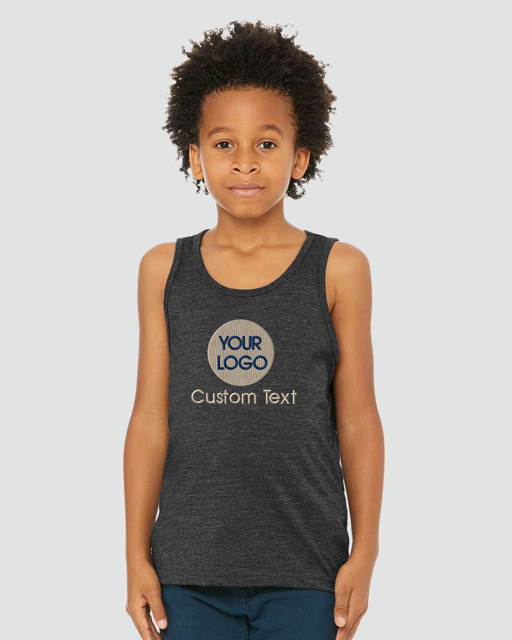 a young girl wearing a dark tank top with a logo on it