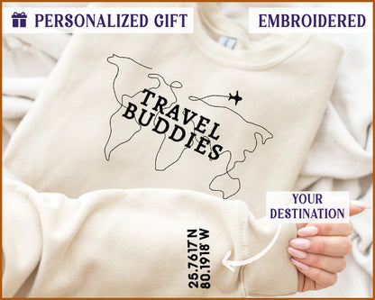 a person holding a bag with a travel buddies t - shirt on it