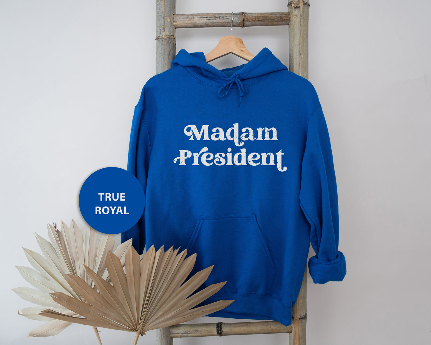 a blue sweatshirt with the words madam president on it