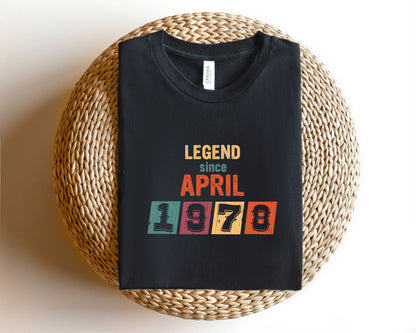 A black t-shirt with a graphic design that says "LEGEND since APRIL 1978" printed on it.