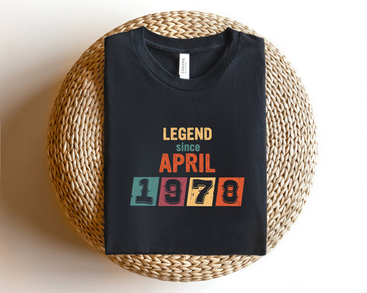 A black t-shirt with a graphic design that says "LEGEND since APRIL 1978" printed on it.